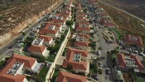 aerial view of a residential neighborhood with houses and green spaces