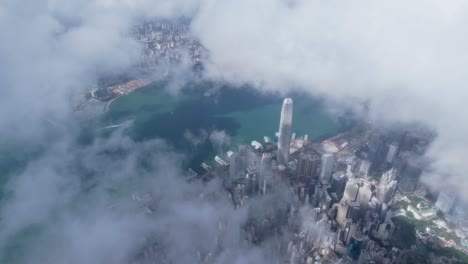 epic aerial view of the victoria harbour in a clear day, with thick cloud and sunlight