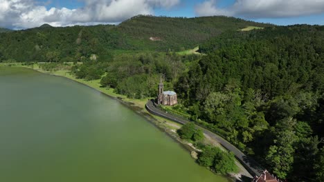 Aerial-Drone-View-Of-Chapel-Of-Nossa-Senhora-das-Vitorias-By-The-Lagoa-das-Furnas-In-Azores,-Portugal