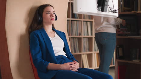 woman listening to music in a record store