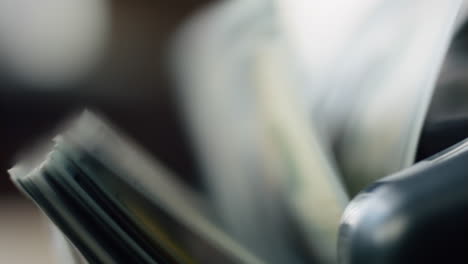 macro shot counter counting bills american currency. machine calculating money.