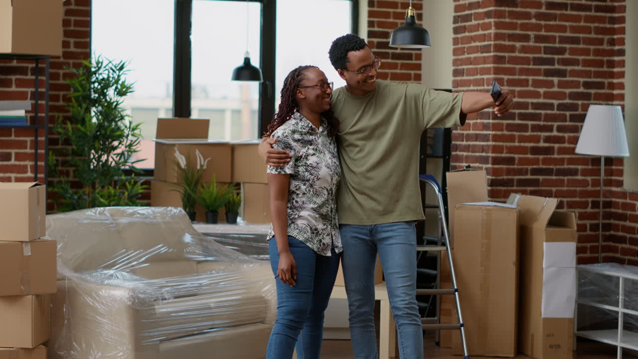 African american partners filming video in new property
