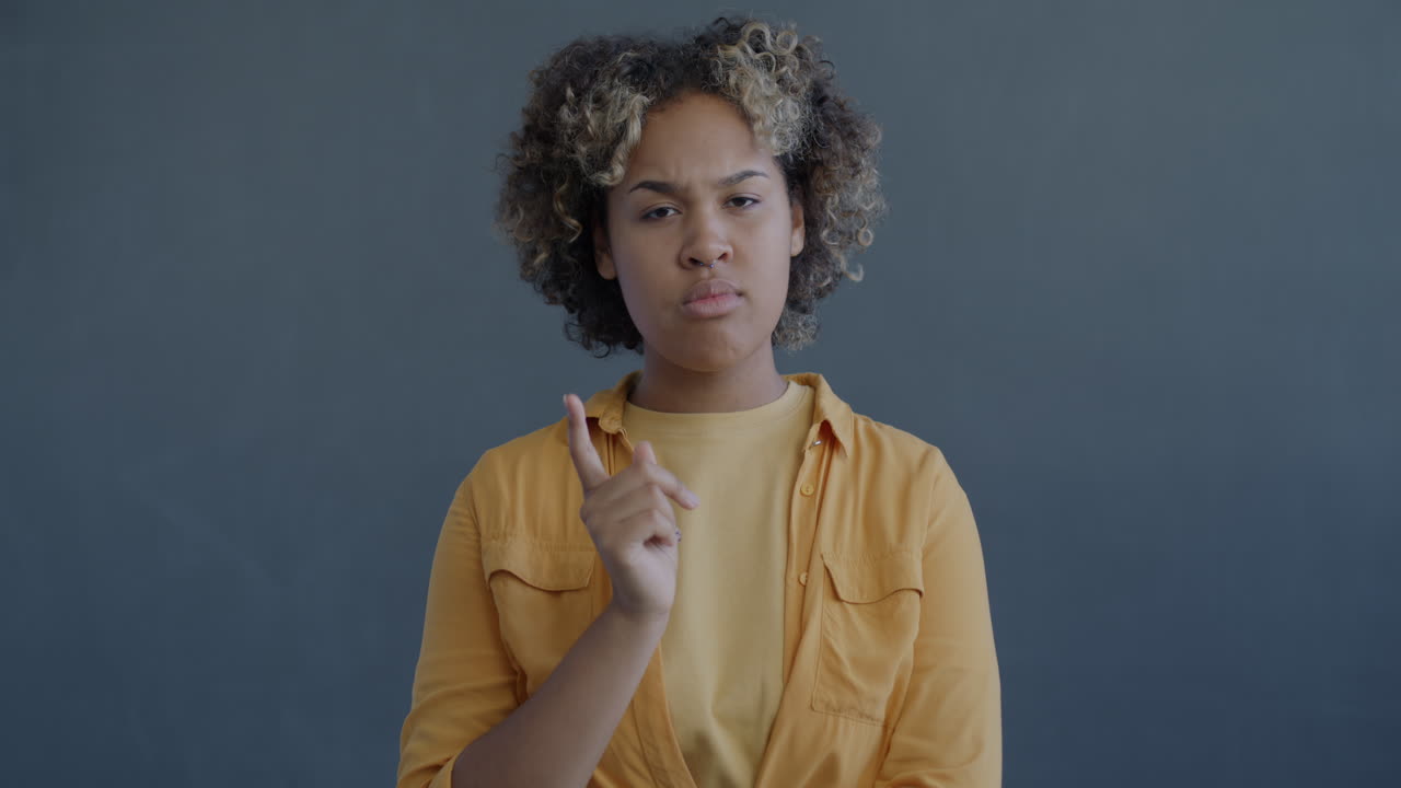 Woman Pointing with Disagreement