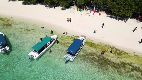 aerial of beach with touristic boats docked, location island hopping in sabah, malaysia, destination unfolds a unique chapter of natural beauty and cultural richness