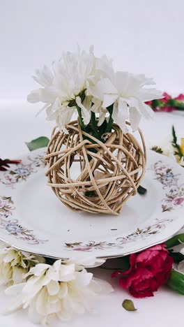 white flowers in wicker sphere