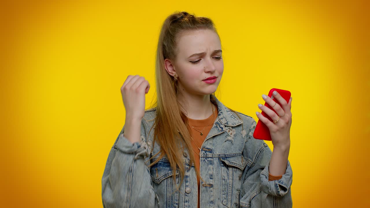 Teen girl use mobile phone browsing, loses, surprised sudden lottery results, bad fortune, loss