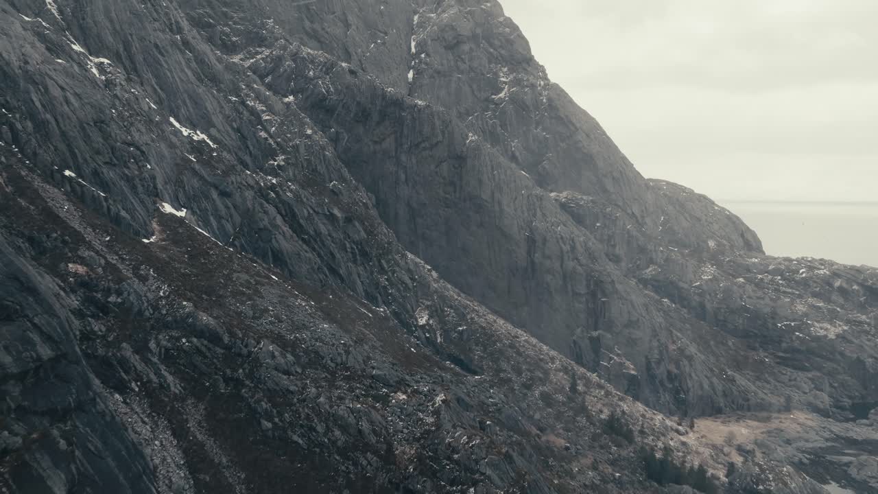 Majestic Mountains Near Historical Fishing Village At Nusfjord In The Lofoten Islands, Norway. Aerial Drone Shot