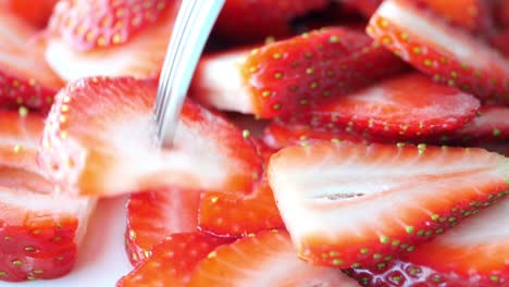 ripe red strawberries in a bowl on table