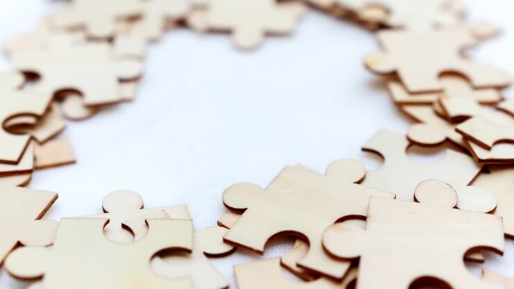 Explore the intricate world of puzzle pieces and the satisfaction of assembly in a cozy indoor setting.