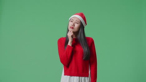 woman in santa hat with different expressions