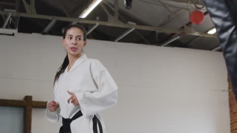 young woman doing martial arts