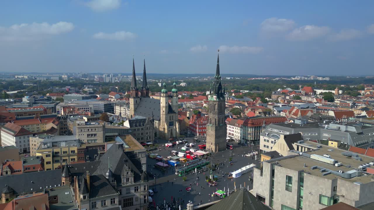 market square with the red tower and st. Mary's church in halle saale, germany. Great aerial view flight pull in drone