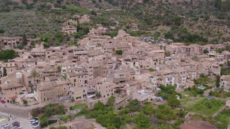 wide shot of fornalutx a charming mountain village at mallorca spain, aerial