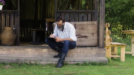 man sitting out of the cabin