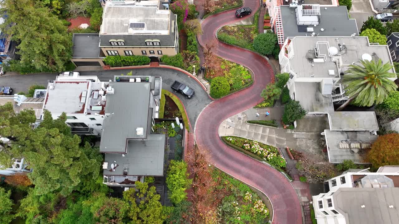 Drone view directly above Lombard Street as a truck enters road, San Francisco