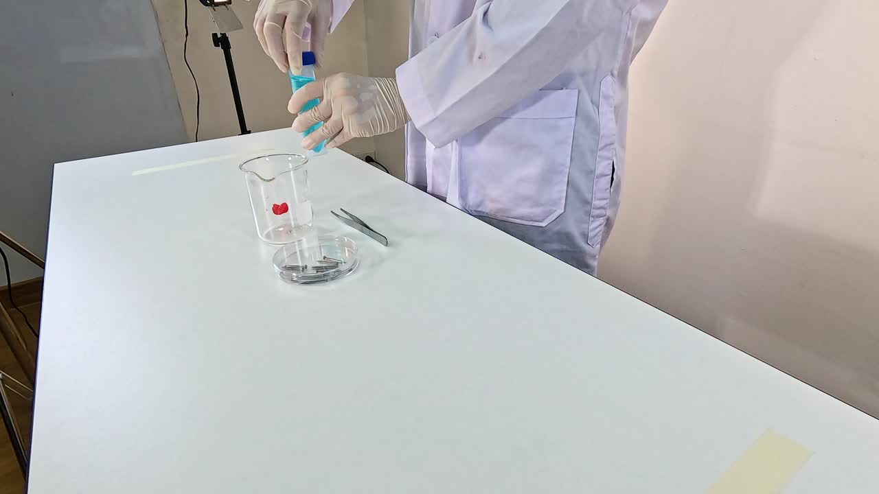 Scientist conducts copper sulfate solution experiment on white table under bright lighting, showcasing chemical reaction process