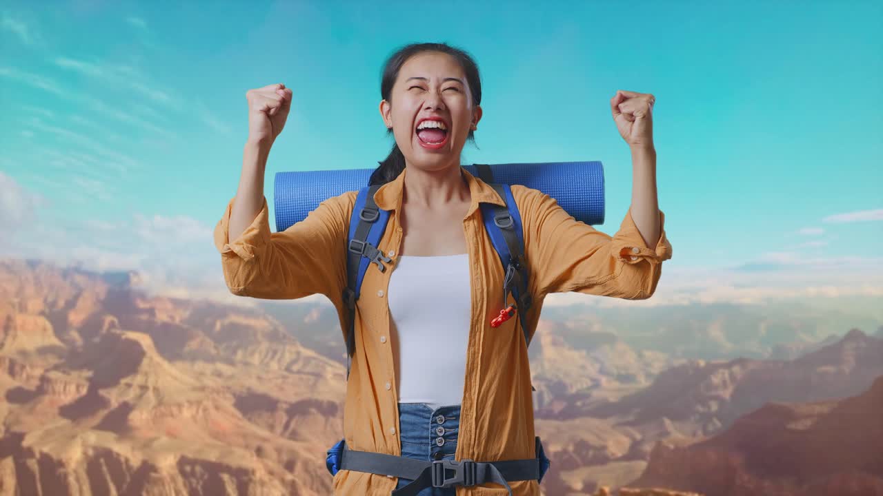 Asian Female Hiker With Mountaineering Backpack Screaming Goal Celebrating The Success While Traveling At The Top Of Mountain