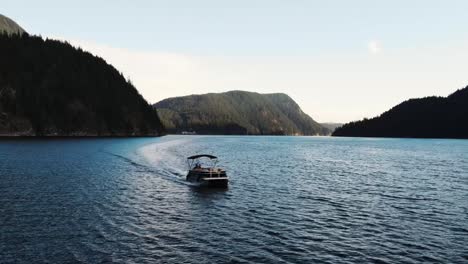 drone shot of boat in indian arm, an ocean in vancouver canada