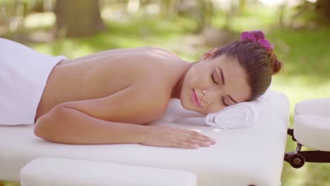 young woman on vacation enjoying a spa treatment