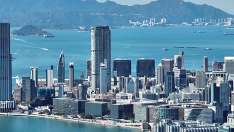 4k tele zoom view of hong kong central district - slow pan aerial view angle from sky.