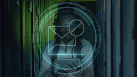 animation of message block icon over african american female engineer using tablet at server room