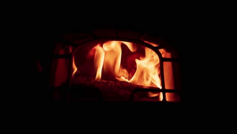 Flame-In-The-Fireplace-With-A-Dark-Background---Close-Up