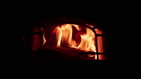 flame in the fireplace with a dark background - close up