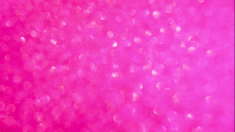 fondo decorativo desenfocado abstracto rosa y dorado con brillo brillante. fondo festivo y navideño para texto. imágenes en 4k