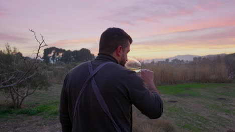 chef stand at the countryside for a wine tasting at sunset