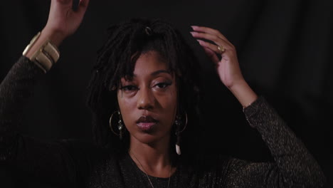 portrait shot of young sensual african american women with black background