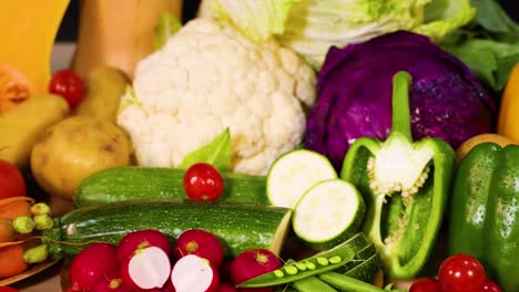 assorted vegetables displayed against a dark backdrop