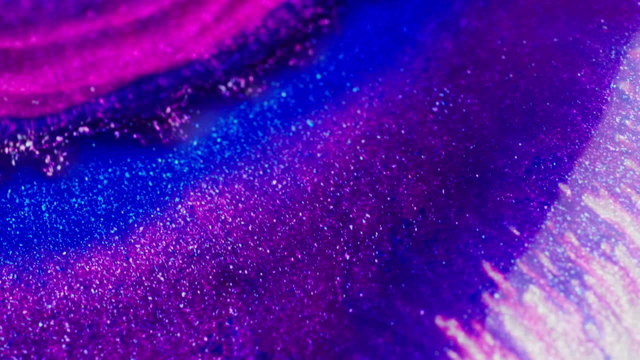 Intense purple and blue ink in motion creating abstract background