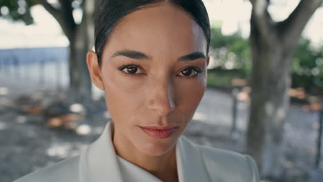 portrait stylish business lady looking camera in white suit. trendy woman posing