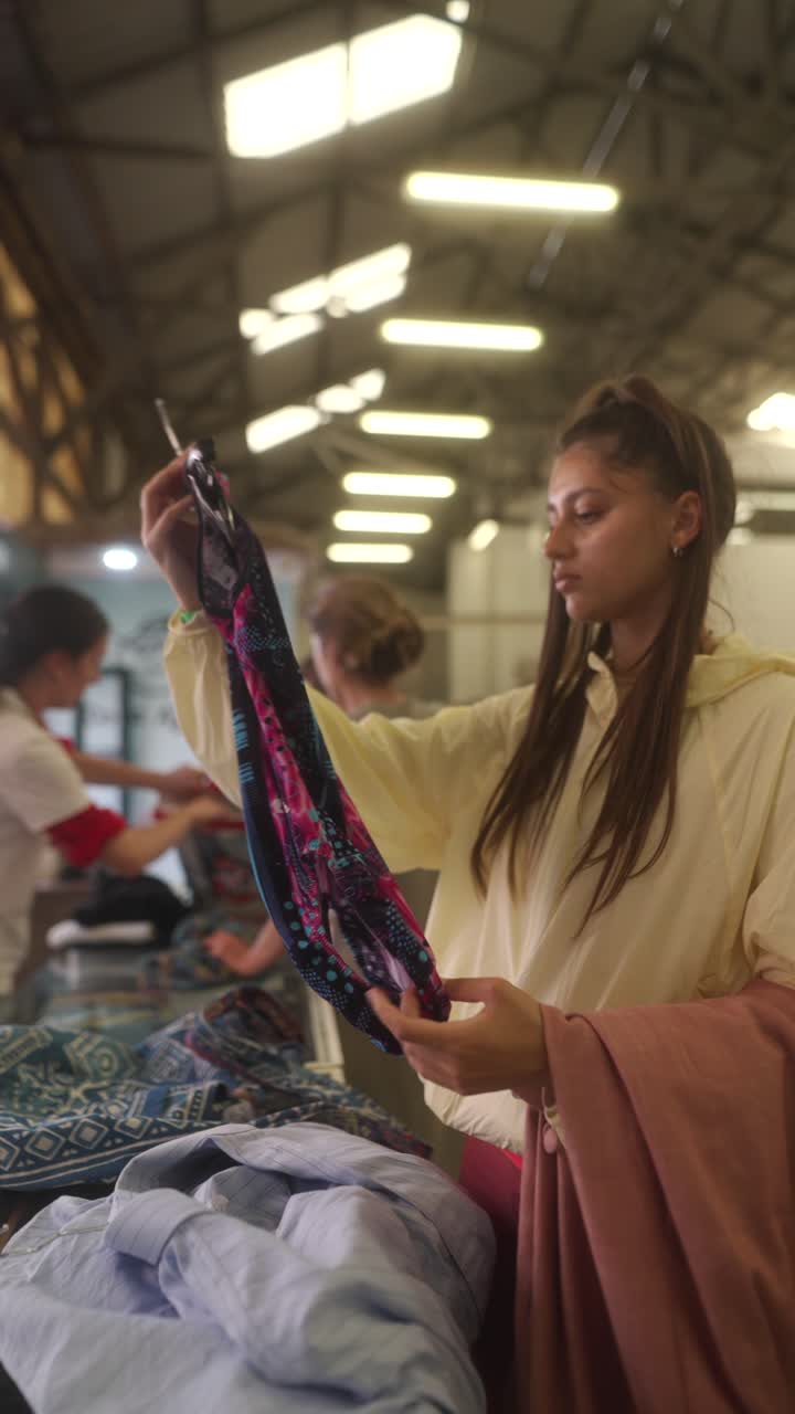 Woman Browsing Secondhand Clothing