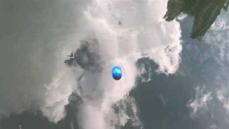 blue-ball-floating-on-river