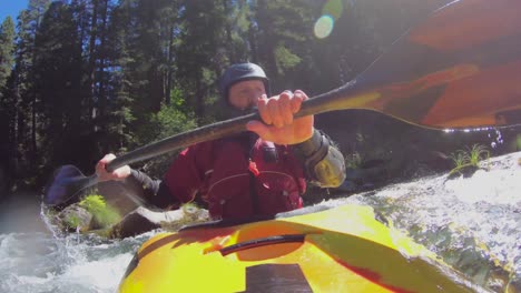 unique point of view of a whitewater kayaker descending class iii river bridge section of the upper rogue river in southern oregon