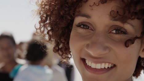 female volunteer looking at camera on the beach 4k