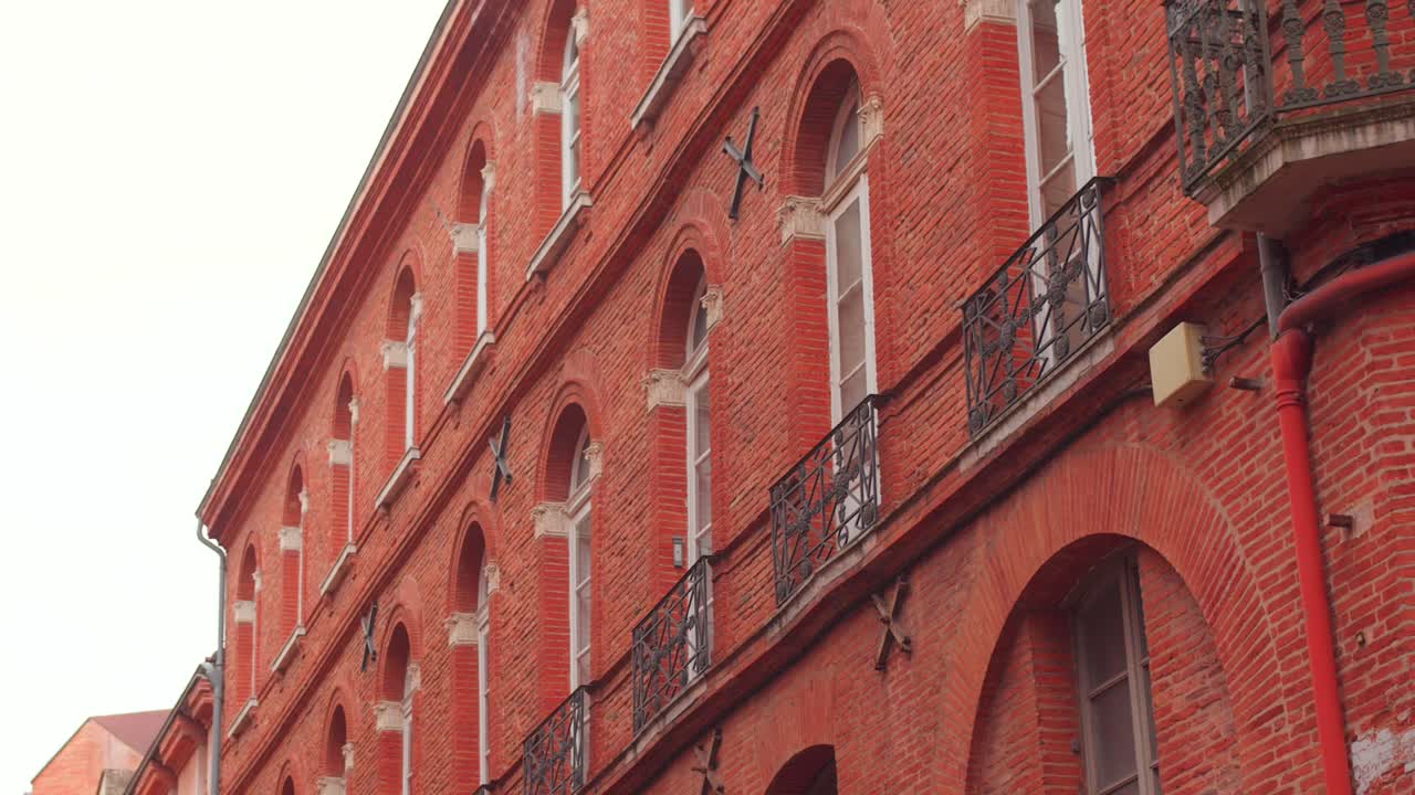 The distinctive charm of Toulouse, France, famously known as the "Pink City." City's unique architecture, highlighting its iconic reddish-orange brick buildings that glow in the sunlight