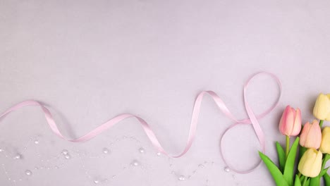 romantic feminine decoration with flowers and ribbons. stop motion