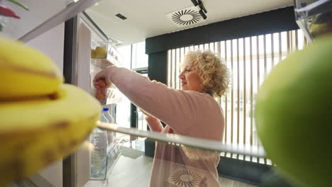 woman opening the refrigerator