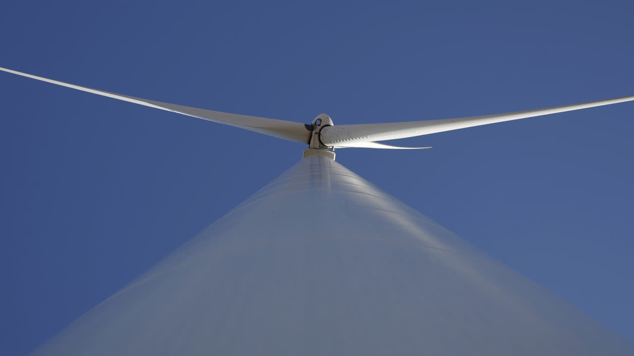 Wind Turbine Against Beautiful Blue Sky - low angle view