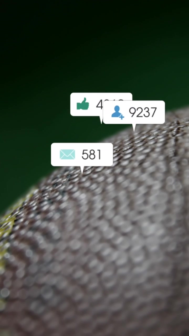 Animation of changing numbers, icons in notification bars over close up of rugby ball on ground