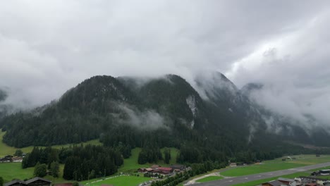 drone shot of three hills in the swiss alps - gstaad, saanen, switzerland - slow push