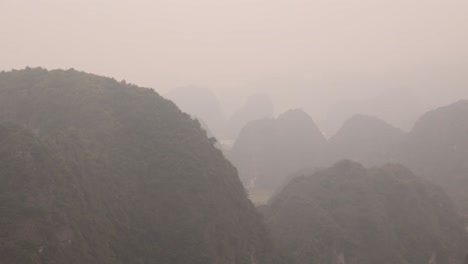 layers-of-mountain-cliffs-in-the-mist-in-the-mountainous-region-of-Ninh-Ninh-in-Northern-Vietnam