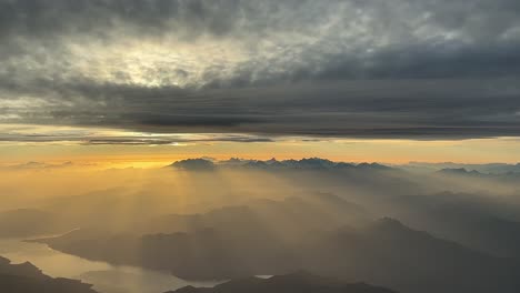 breathtaking view of the italian alps and lago maggiore shot from a jet cockpit flying at 9000m high northbound just before sunset