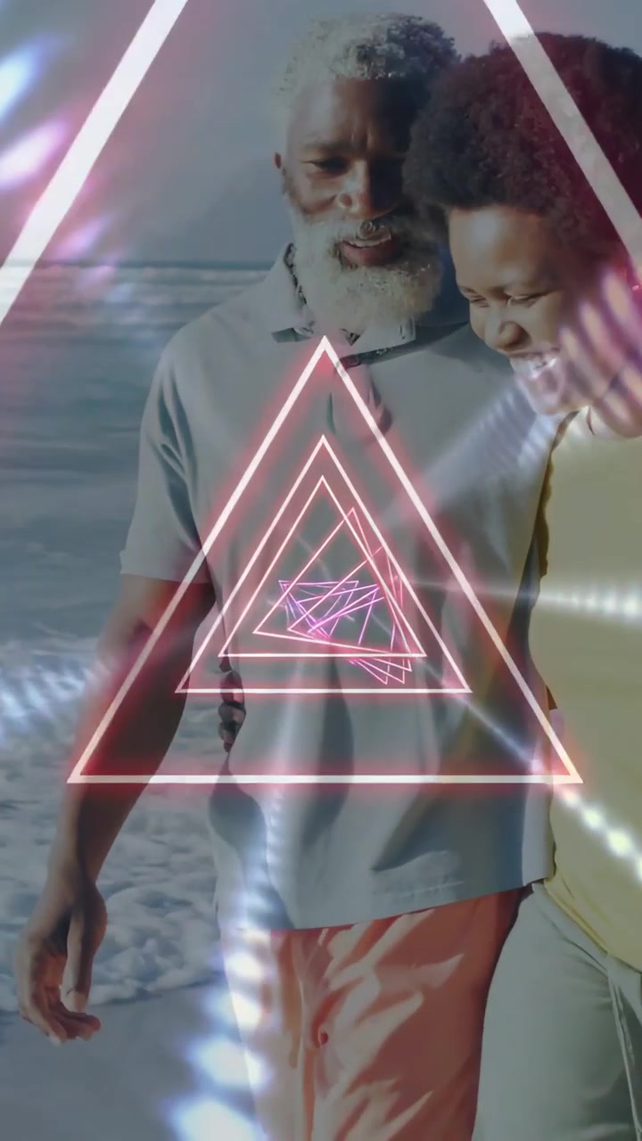 Vertical video: Couple walking on shore neon triangle appearing over them and pulsing for marketing