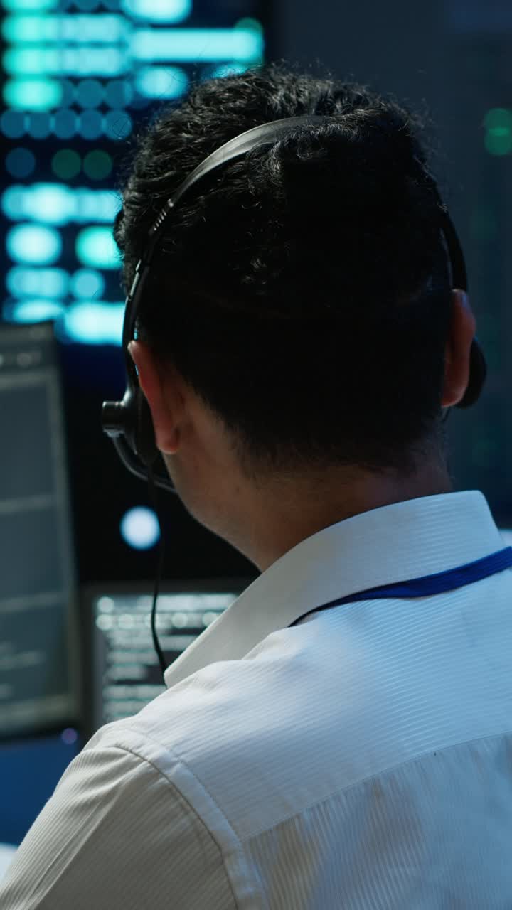 Professional Man Wearing Headset Working in a Call Center