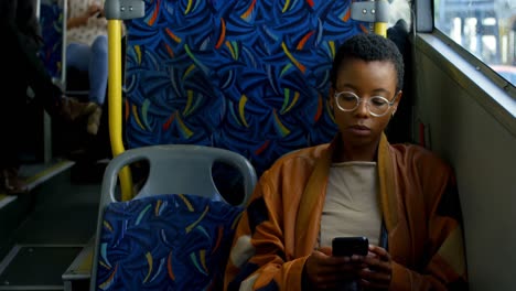 female commuter using mobile phone in bus 4k