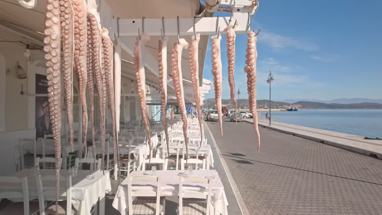 Fresh Octopus tentacles displayed outside Greek harbour fishfood rerstaurant