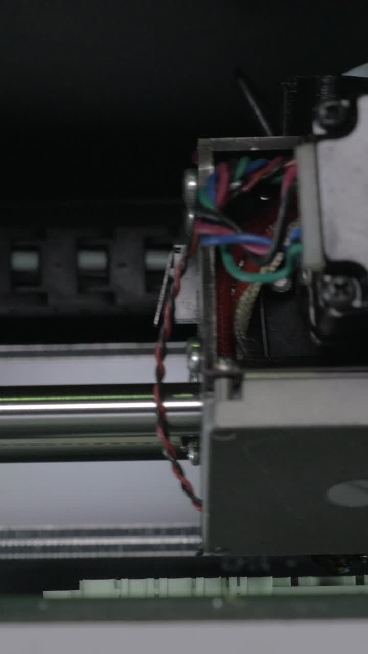 Close Up of Printer Head Mechanism Moving Back and Forth